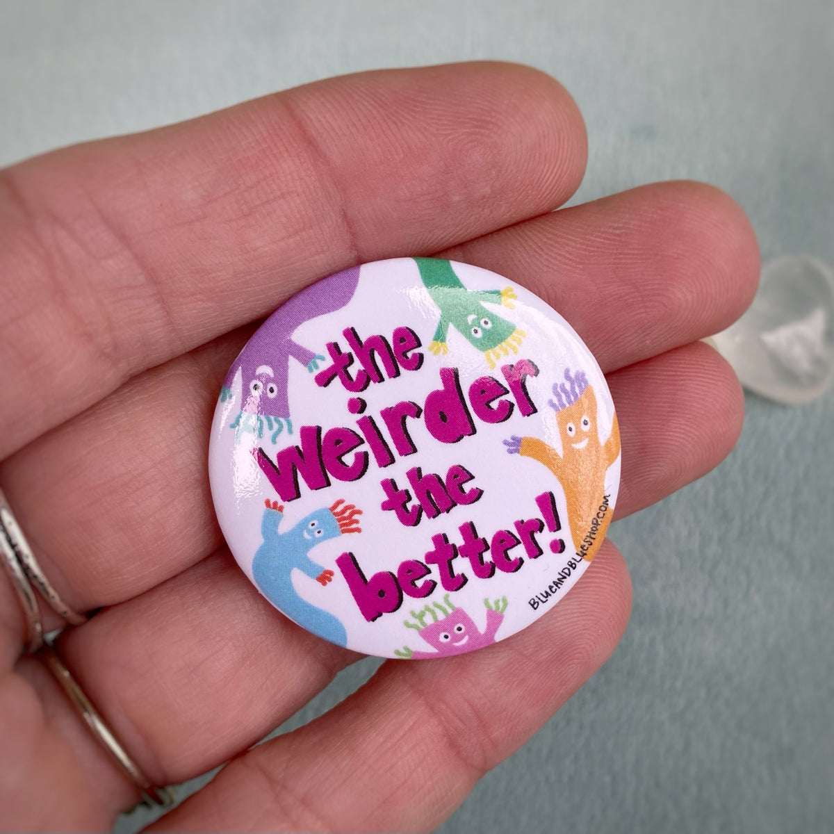 “The Weirder the Better” 1.5” Pin-back Button – Blue and Blue